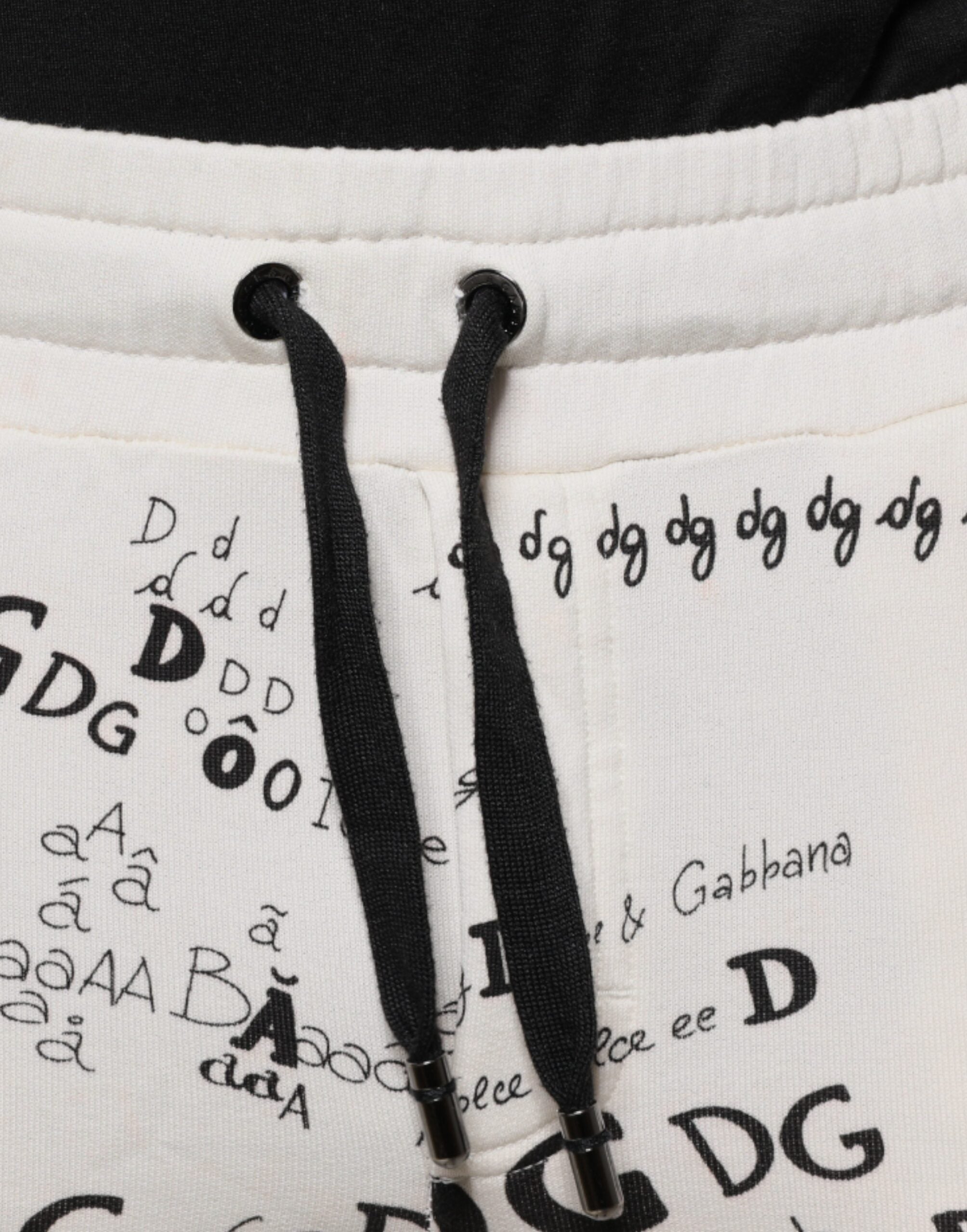 Pantalon jogging en coton blanc imprimé Dolce & Gabbana, style décontracté avec élastiques à la taille et aux chevilles.