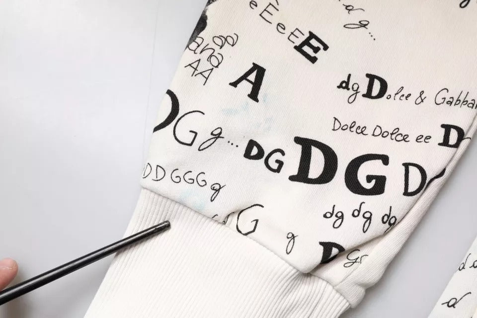 Pantalon de survêtement en coton blanc imprimé de Dolce & Gabbana, style jogger, avec détails élégants et confortables.
