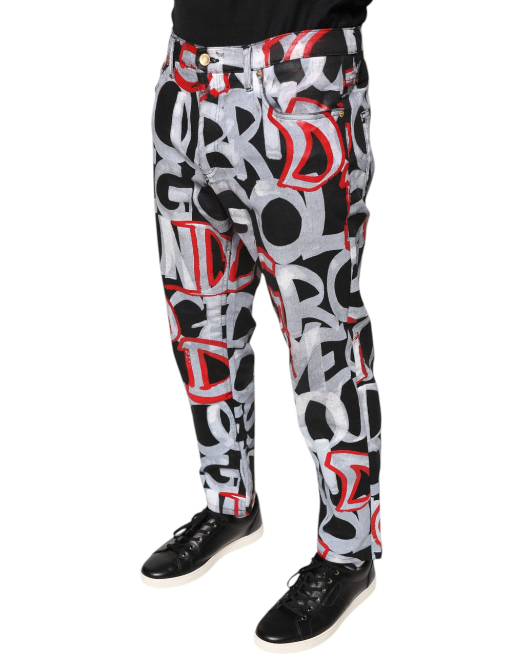 Jeans skinny en denim multicolore en coton Dolce & Gabbana avec monogramme, visibles sur l'image.