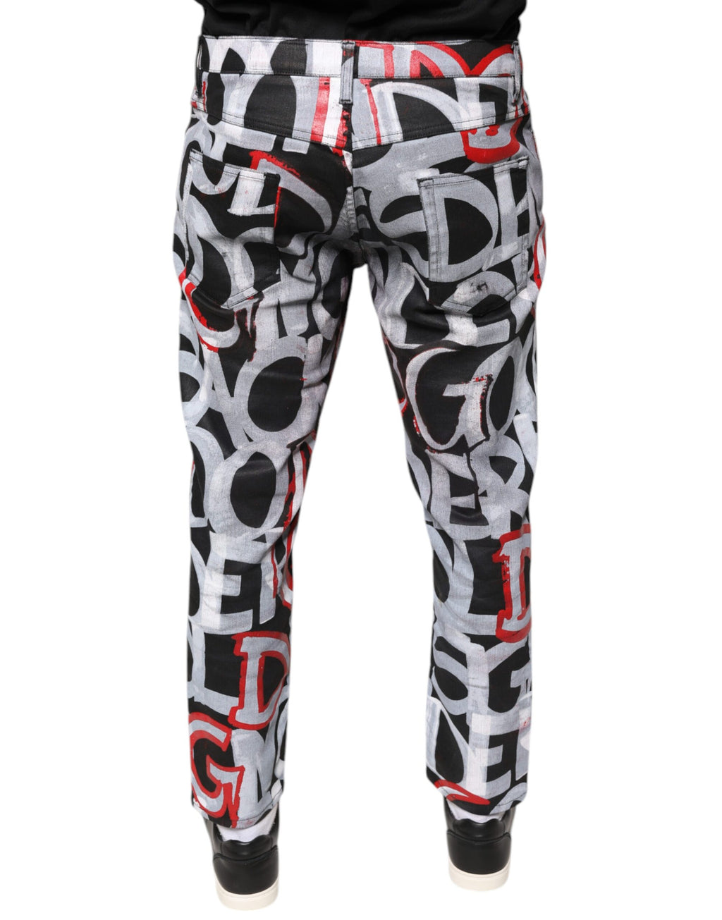 Jeans skinny en denim multicolore en coton Dolce & Gabbana avec monogramme, visibles sur l'image.