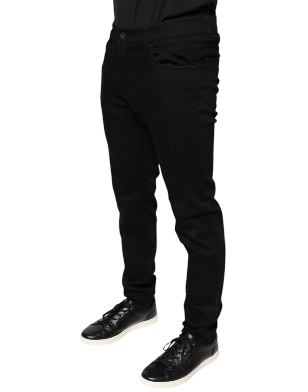 Jeans skinny en coton stretch noir de Dolce & Gabbana pour homme, denim ajusté et tendance, visible en gros plan.