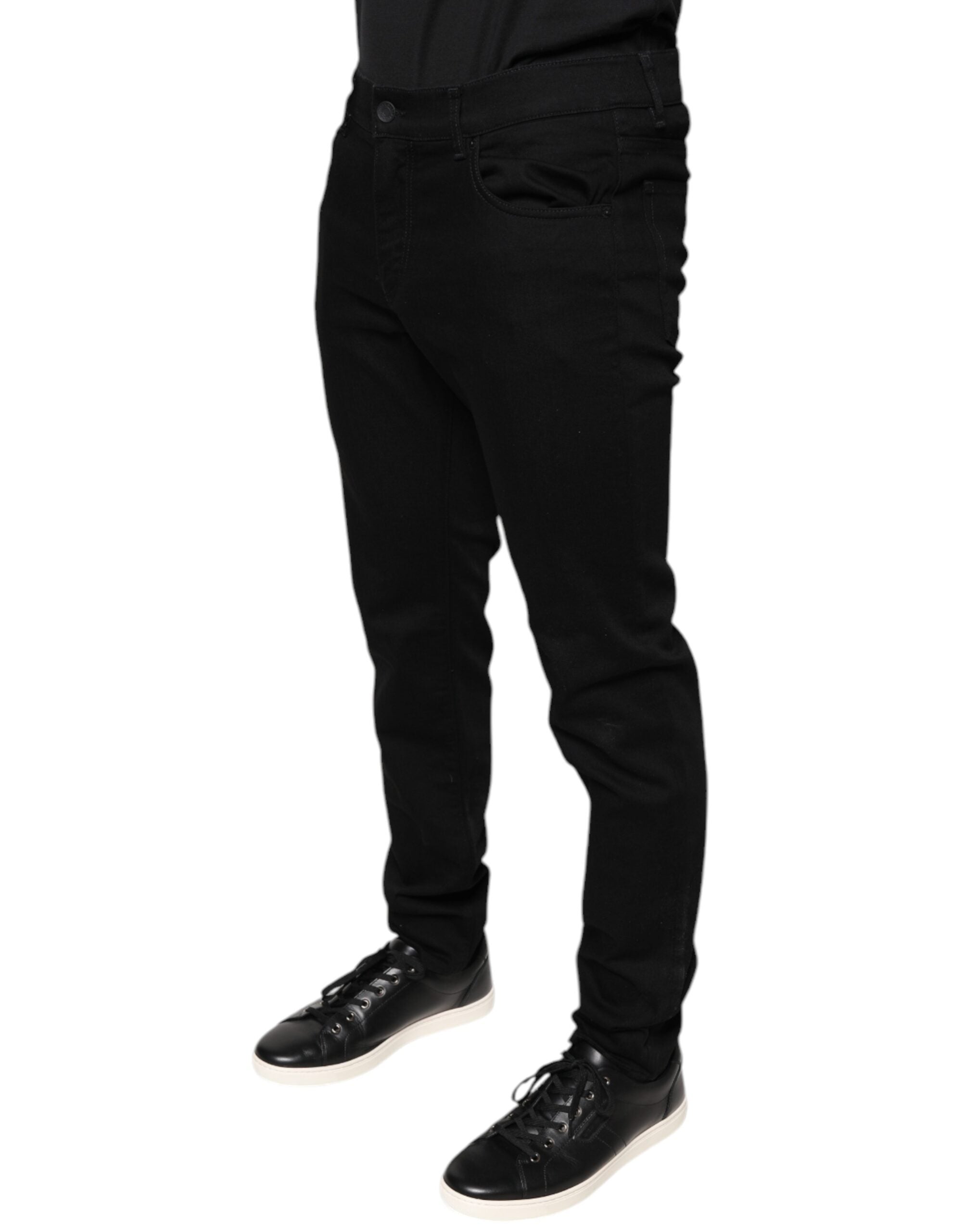 Jeans skinny en coton stretch noir de Dolce & Gabbana pour homme, denim ajusté et tendance, visible en gros plan.