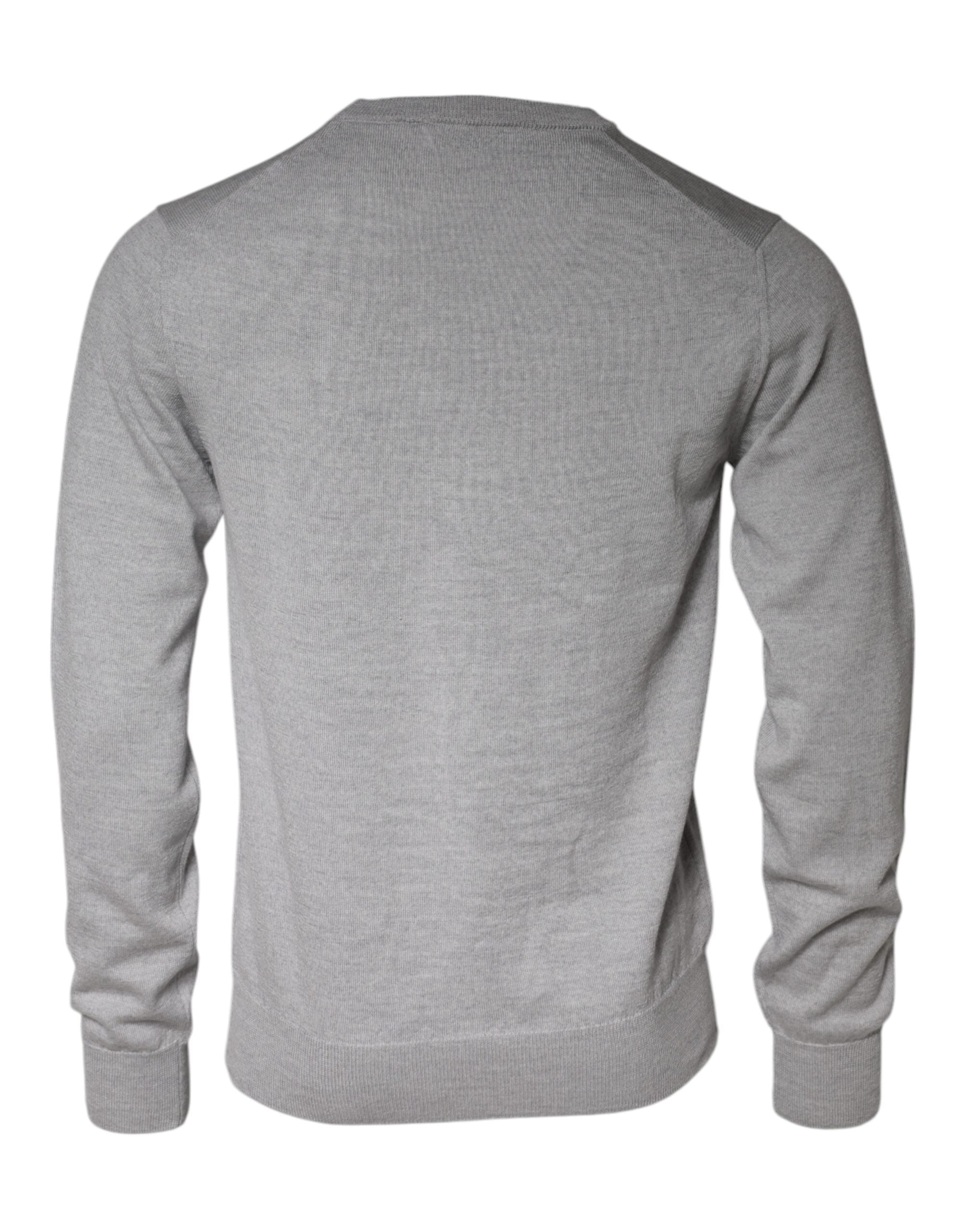 Pull en laine gris clair Dolce & Gabbana à col rond, vue de face, détail du tissu doux et finition élégante.