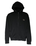 Sweat à capuche zippé noir Dolce & Gabbana avec plaque logo, design moderne et logo visible sur la poitrine.