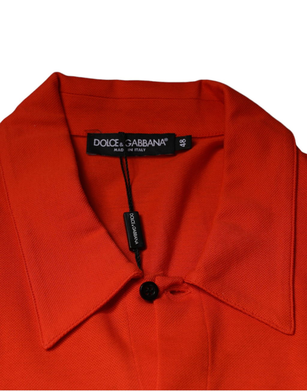 Chemise polo décontractée en coton orange de Dolce & Gabbana, avec boutons et style casual visible sur l'image.