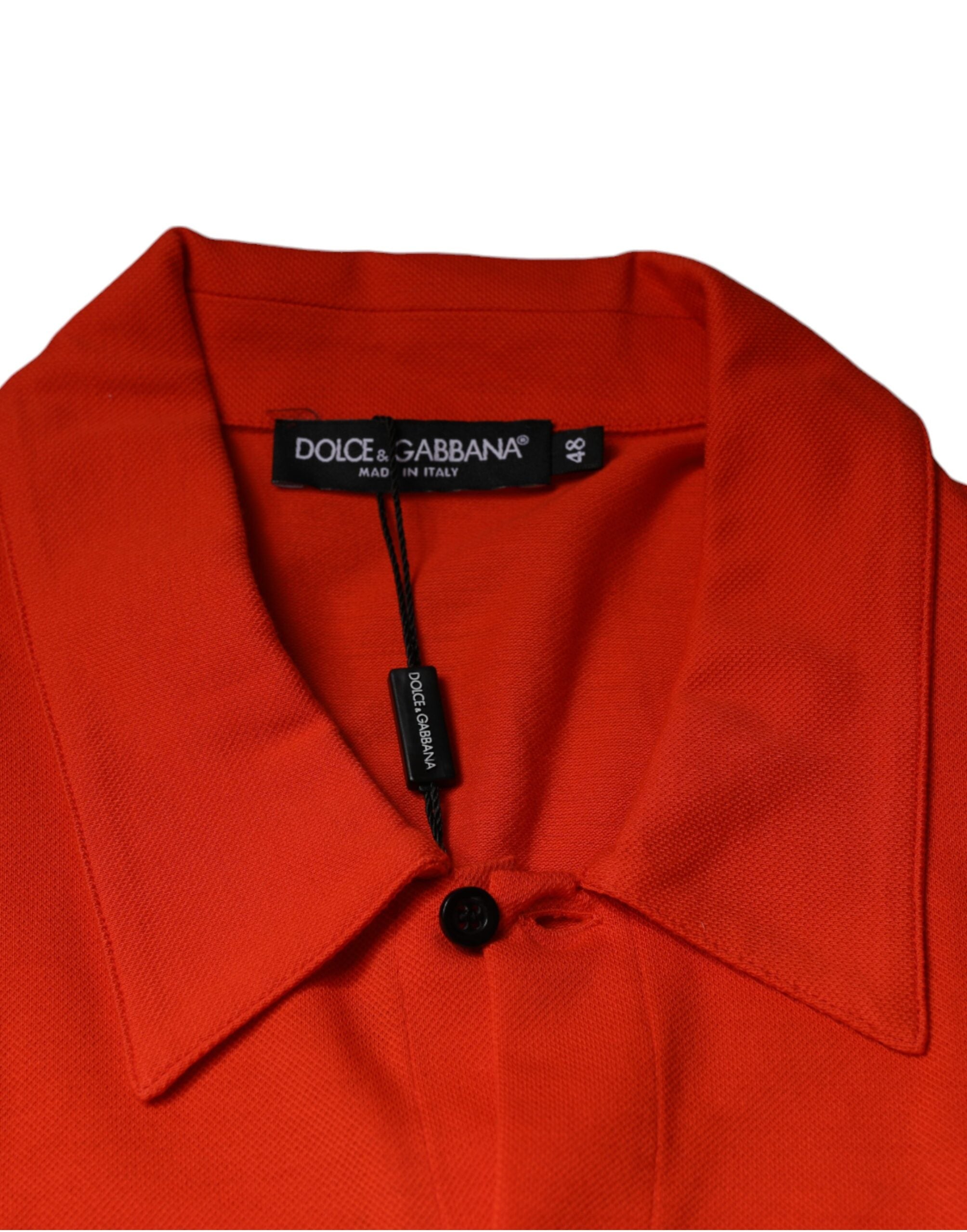Chemise polo décontractée en coton orange de Dolce & Gabbana, avec boutons et style casual visible sur l'image.