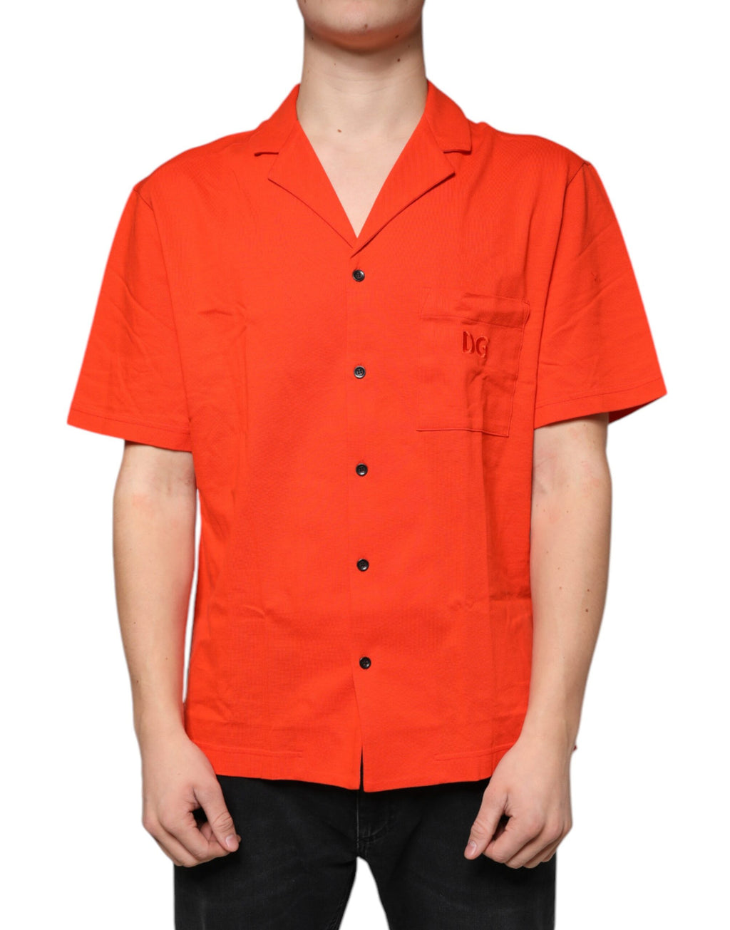 Chemise polo décontractée en coton orange Dolce & Gabbana avec boutons, vue de face sur fond neutre.