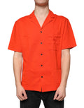 Chemise polo décontractée en coton orange Dolce & Gabbana avec boutons, vue de face sur fond neutre.