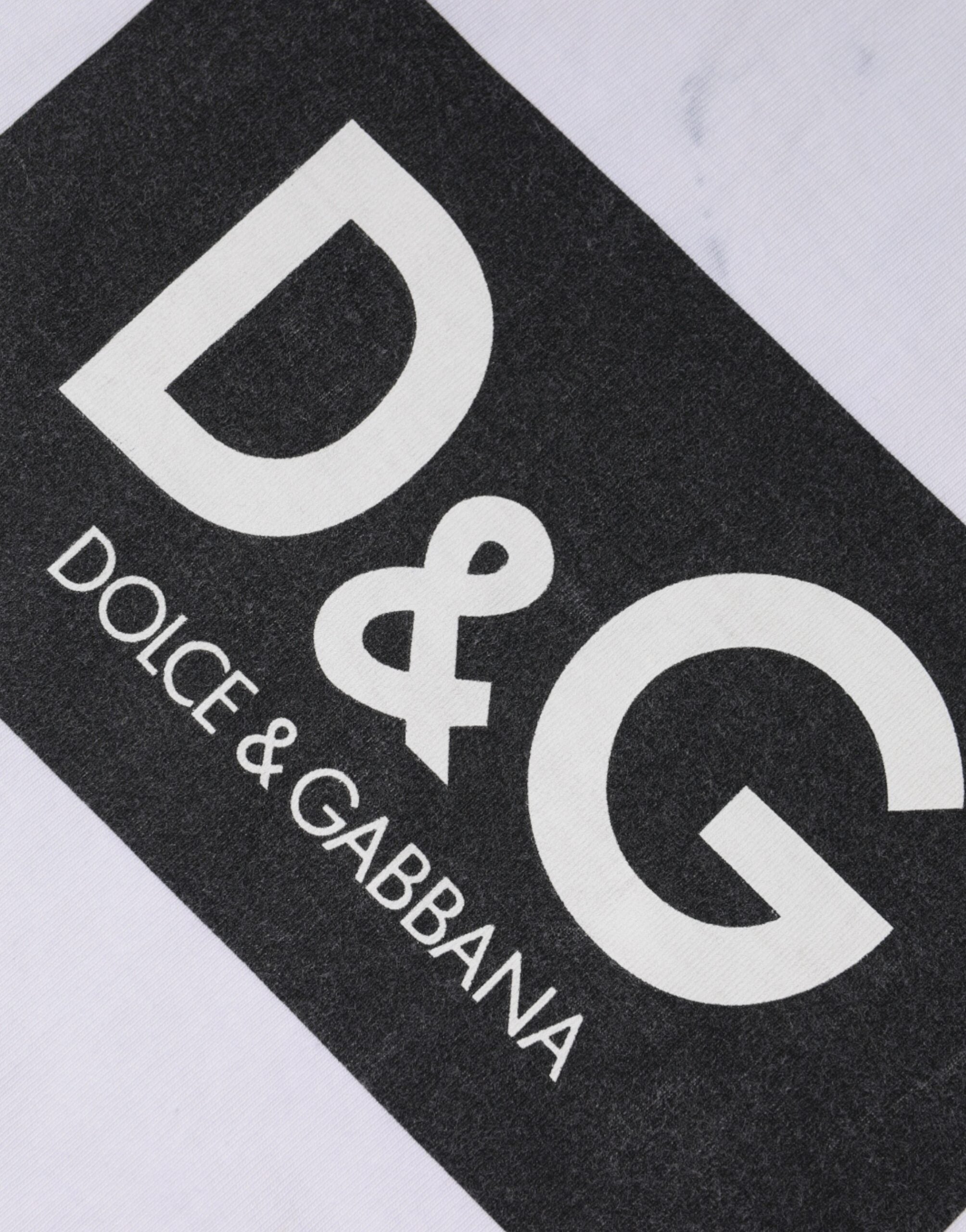 T-shirt blanc en coton Dolce & Gabbana avec logo imprimé, col rond, vue de face.
