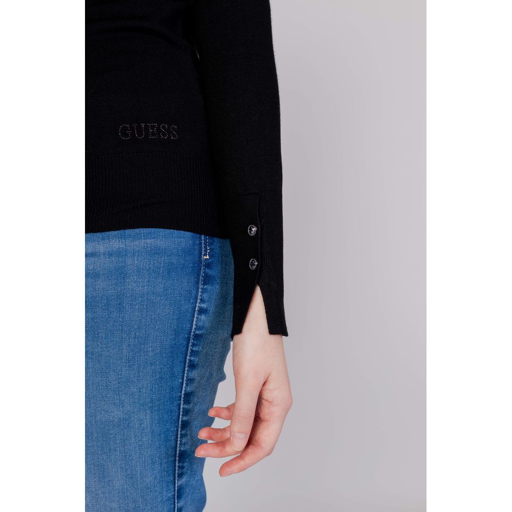 Sweatshirt en coton noir de la marque Guess, coupe décontractée et design simple, parfait pour un look casual.