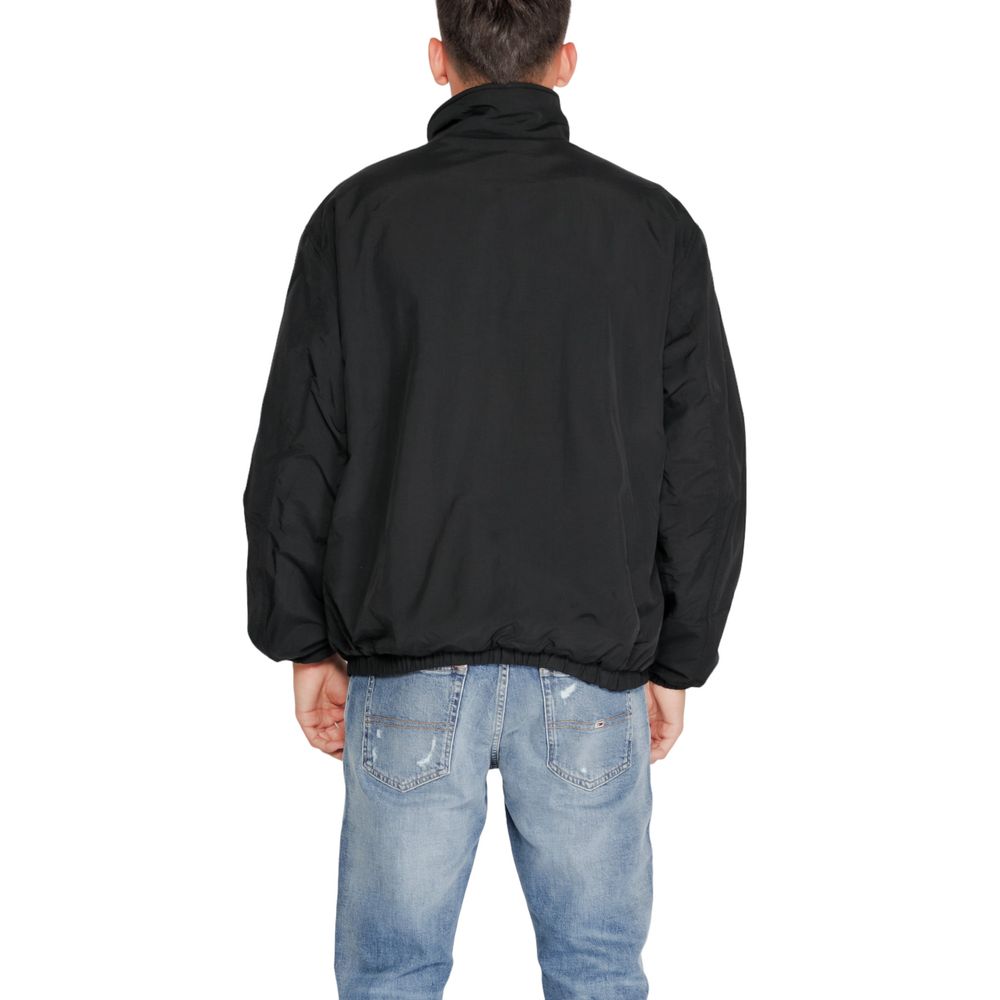 Veste shell en polyester recyclé noire Tommy Hilfiger Jeans, style décontracté avec détails modernes.