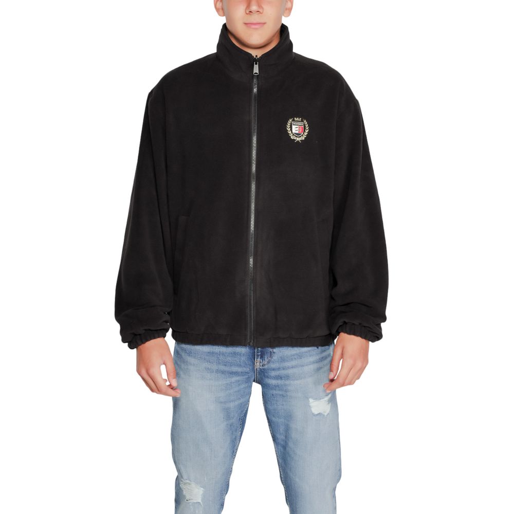 Veste Tommy Hilfiger Jeans noire en polyester recyclé, avec coupe décontractée et détails modernes, vue de face.