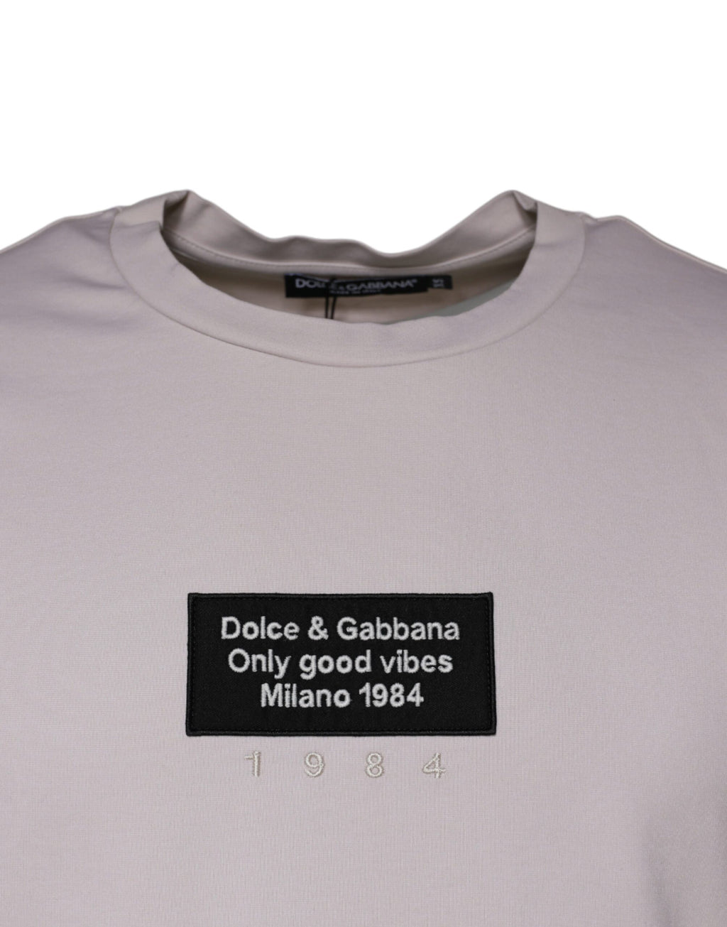 T-shirt beige en coton mélangé avec logo Dolce & Gabbana, col rond, vue de face.
