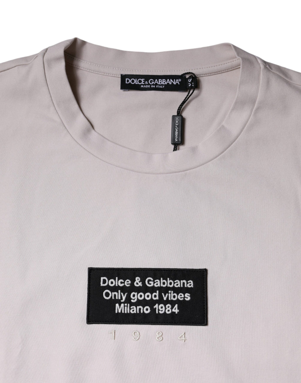 T-shirt beige Dolce & Gabbana en coton mélangé avec logo, col rond, vue de face.