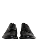Chaussures derby en cuir noir Dolce & Gabbana, chaussures formelles avec détails wingtip, pour homme élégants et sophistiqués.