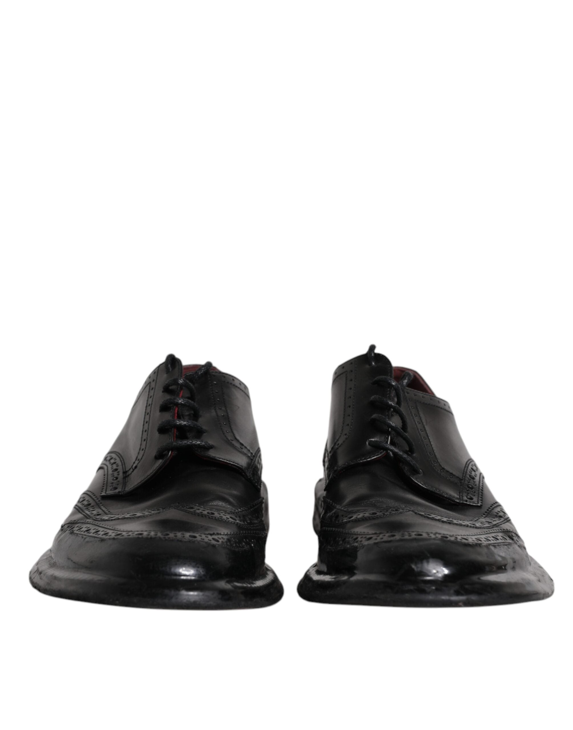 Chaussures derby en cuir noir Dolce & Gabbana, chaussures formelles avec détails wingtip, pour homme élégants et sophistiqués.