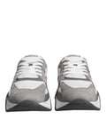 Chaussures sneakers basses Versace Squalo en cuir gris et néoprène, style chunky et moderne, vue de face sur fond neutre.