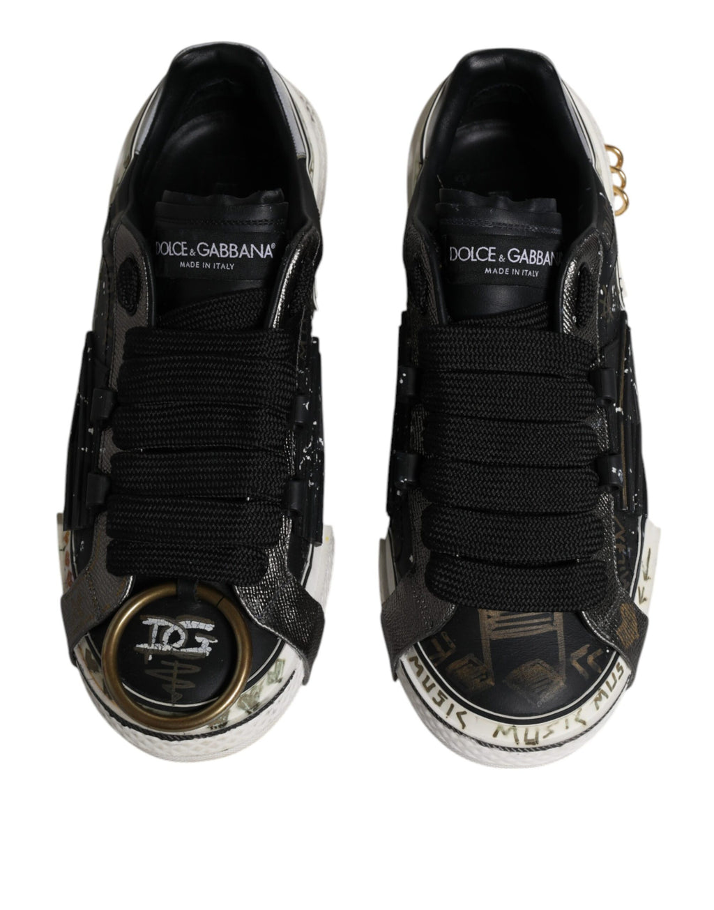 Chaussures basses Dolce & Gabbana Portofino noires et blanches, sneakers en cuir avec design élégant et détails tendance.