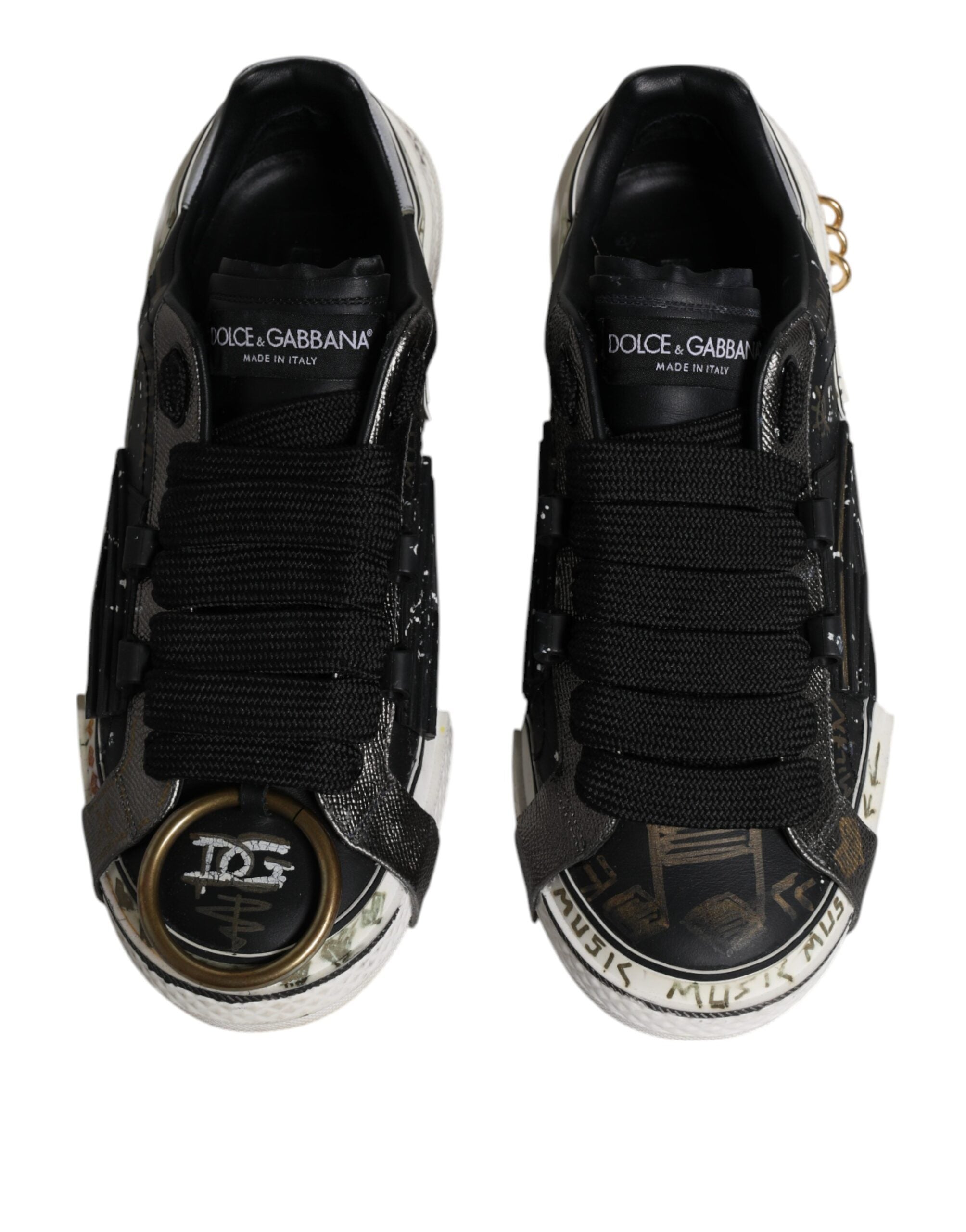 Chaussures basses Dolce & Gabbana Portofino noires et blanches, sneakers en cuir avec design élégant et détails tendance.