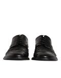 Chaussures derby en cuir noir Dolce & Gabbana, souliers formels à bout en wingtip avec détails élégants et finition sophistiquée.