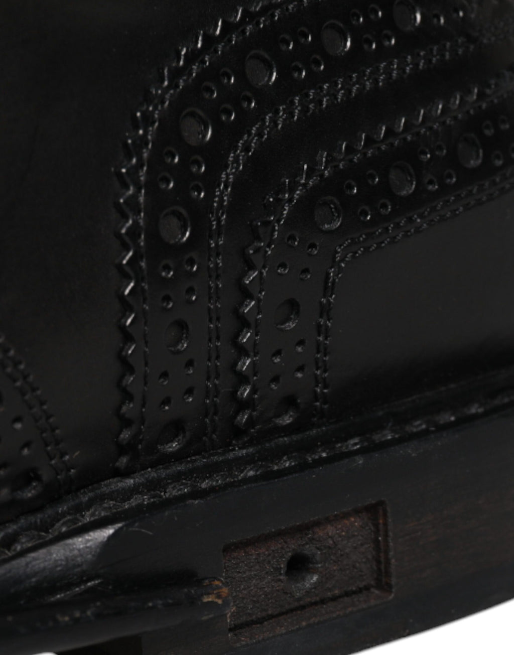 Chaussures Derby en cuir noir Dolce & Gabbana avec design wingtip formel, vue de face.