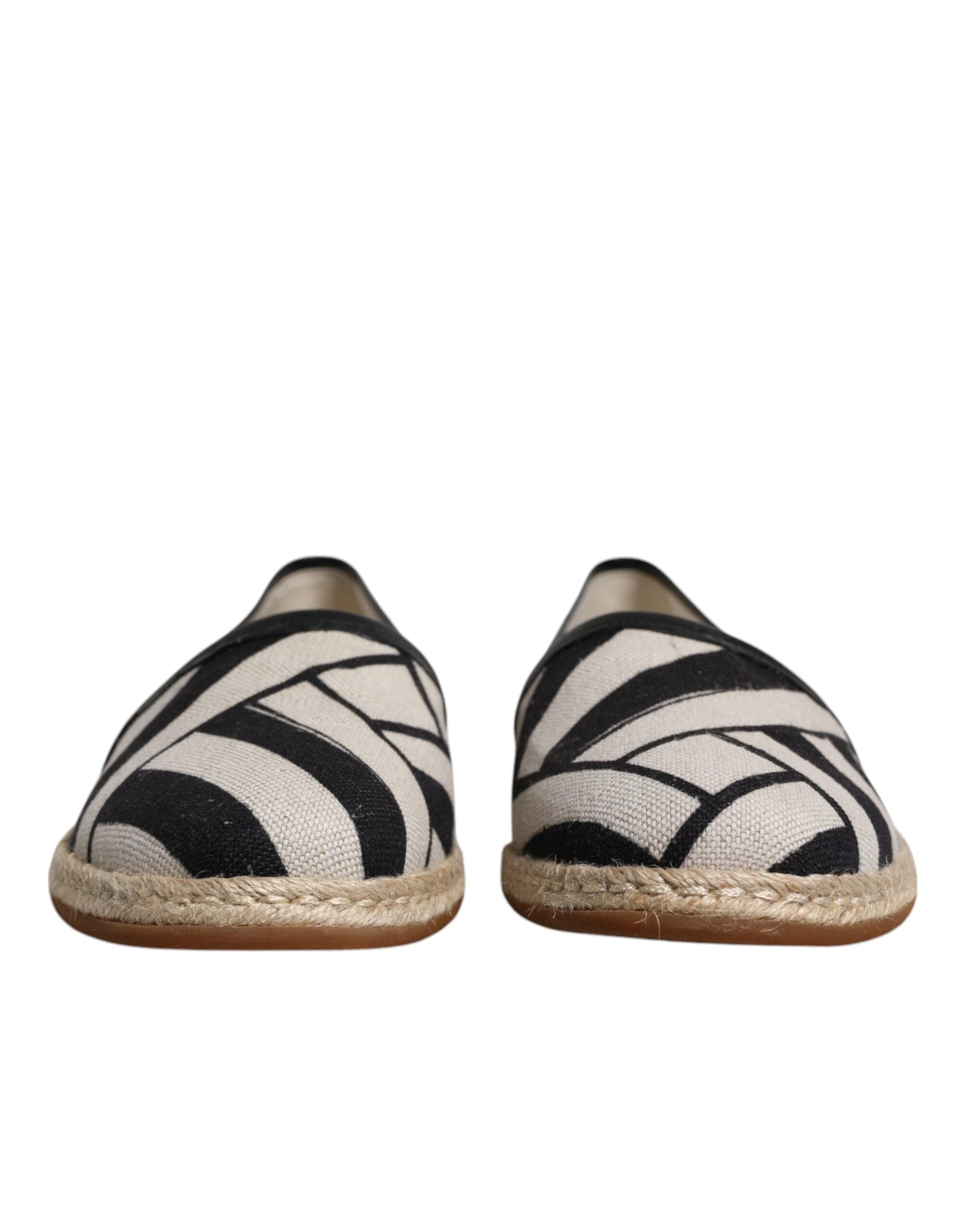 Chaussures espadrilles Dolce & Gabbana à rayures noires et blanches, style slip-on élégante et confortable.