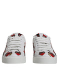 Chaussures portofino blanches Dolce & Gabbana avec visage de diable sur le devant, sneakers tendance et élégants.