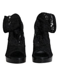 Bottes noires en dentelle extensible Dolce & Gabbana Taormina, style élégant avec finition raffinée, pour femmes.