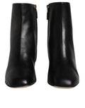 Bottes en cuir noir Dolce & Gabbana Jackie mi-mollet, chaussures élégantes à la mode avec détail en cuir.