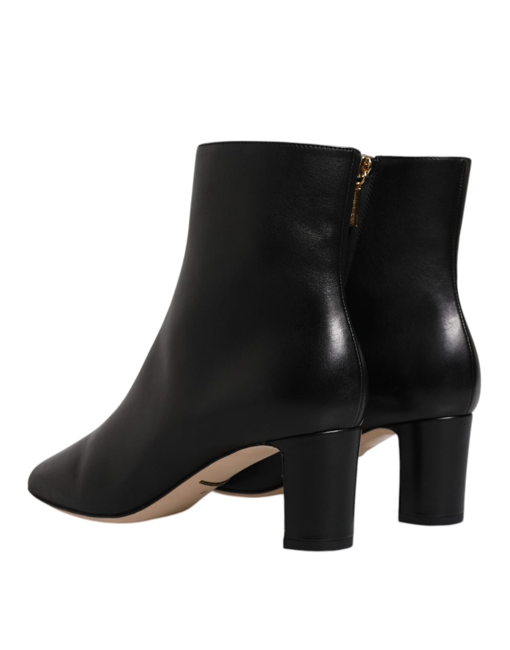 Bottes en cuir noir Dolce & Gabbana Jackie, mi-mollet, style élégant et sophistiqué, visibles sur l'image.