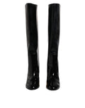 Bottes hautes en cuir verni noir Dolce & Gabbana Vally, chaussures élégantes avec finition brillante et talons hauts.