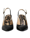Chaussures à talons haut en cuir noir Dolce & Gabbana, sandales slingbacks élégantes avec boucle métallique.