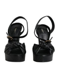 Sandales à talons plateforme en cuir noir de Dolce & Gabbana, chaussures élégantes avec semelle épaisse et design sophistiqué.