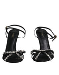 Sandales à talons en cuir noir Dolce & Gabbana avec cristaux, semelles élégantes et design sophistiqué.