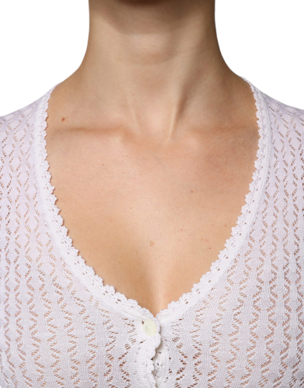 Cardigan blanc en soie Dolce & Gabbana à boutons, vue de face avec col classique et manches longues.