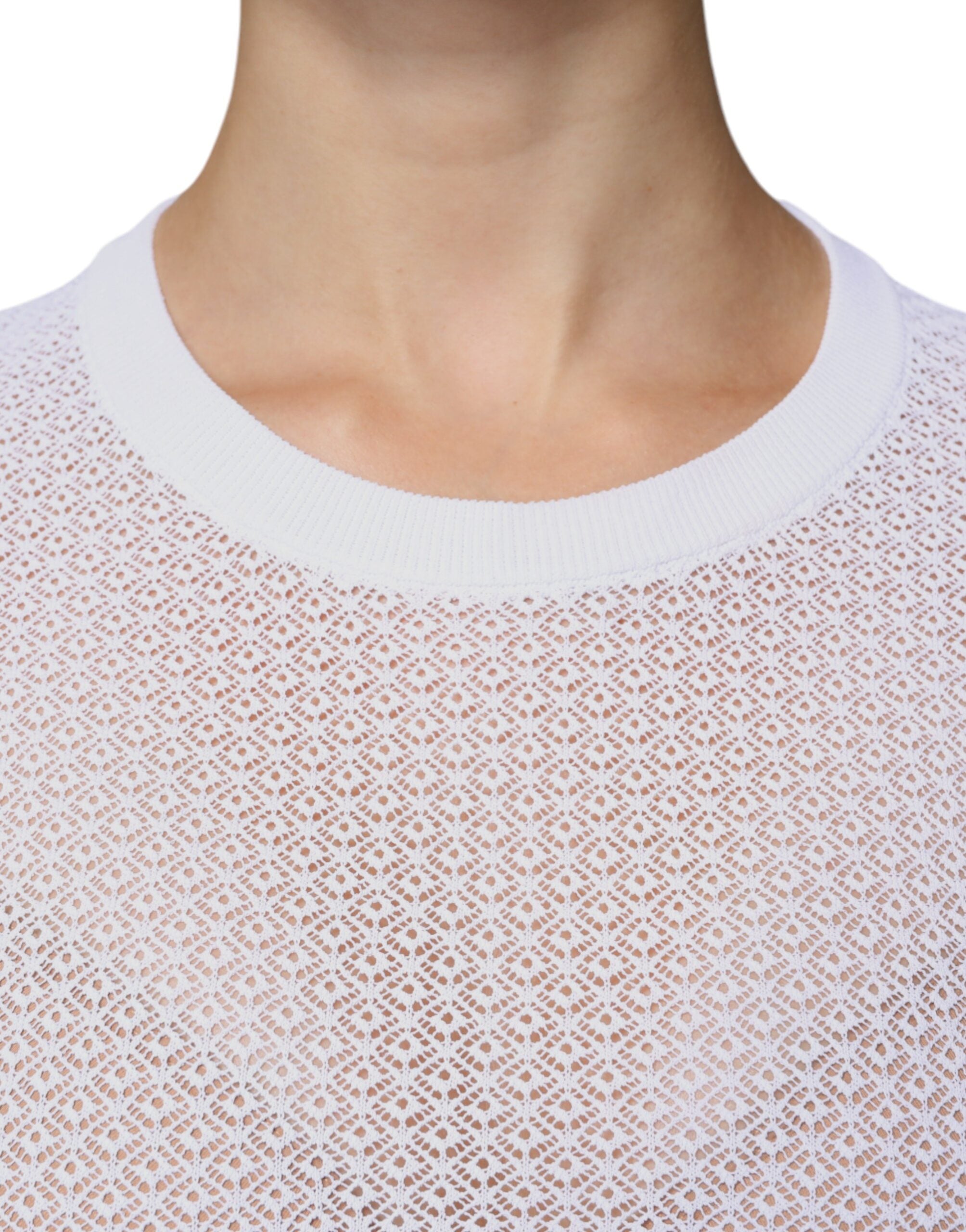 Haut en mesh blanc à manches longues de Dolce & Gabbana, transparent, avec détails élégants en tissu léger et sophistiqué.