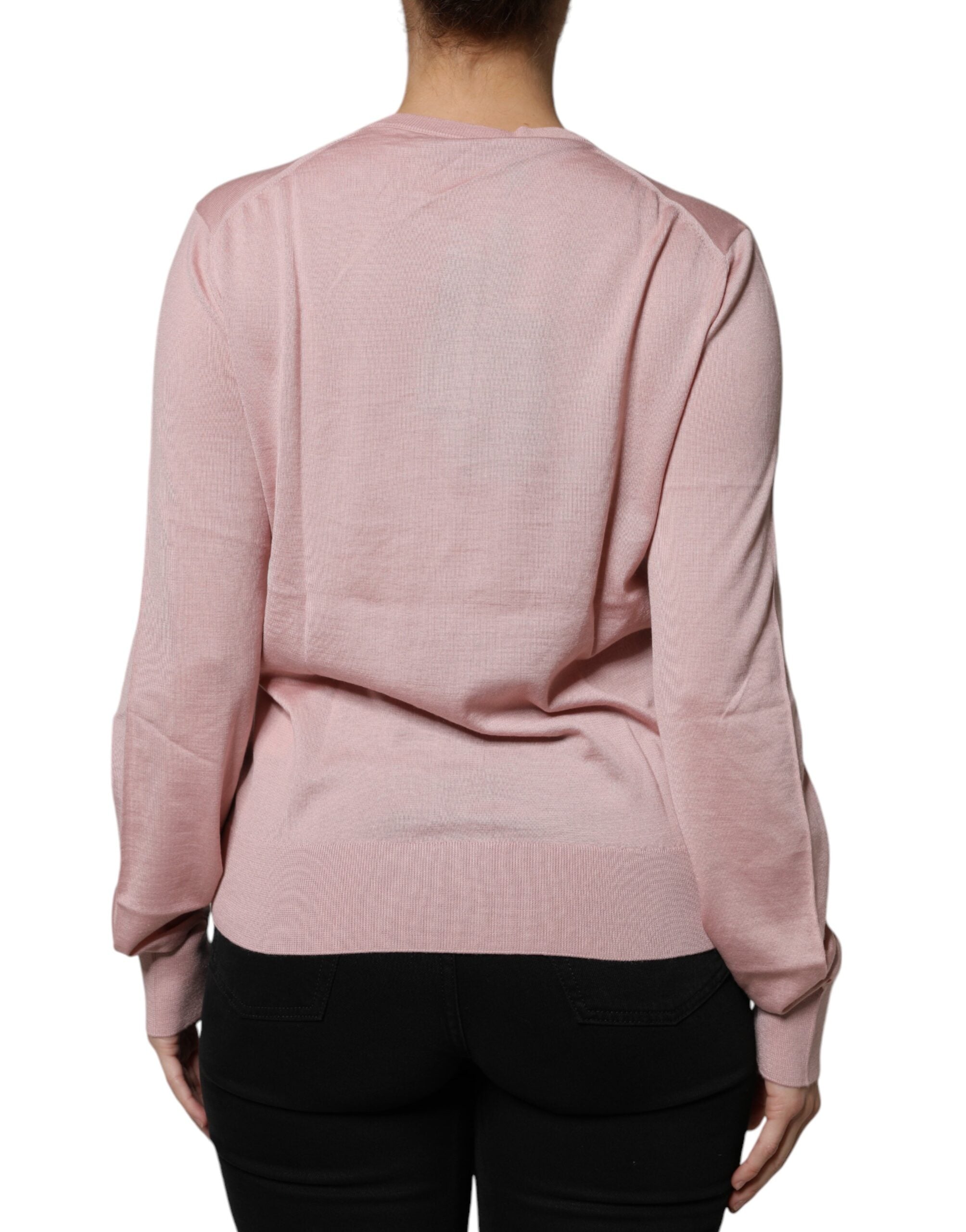 Cardigan en laine rose Dolce & Gabbana avec boutons, pull-over élégant, détail tricot chaud et mode pour femme.