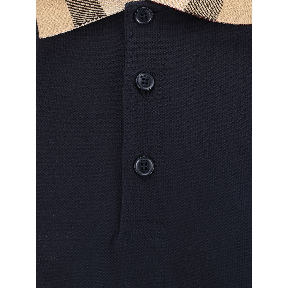 Chemise polo en coton bleu Burberry, vue de face, avec col classique et logo discret sur la poitrine.