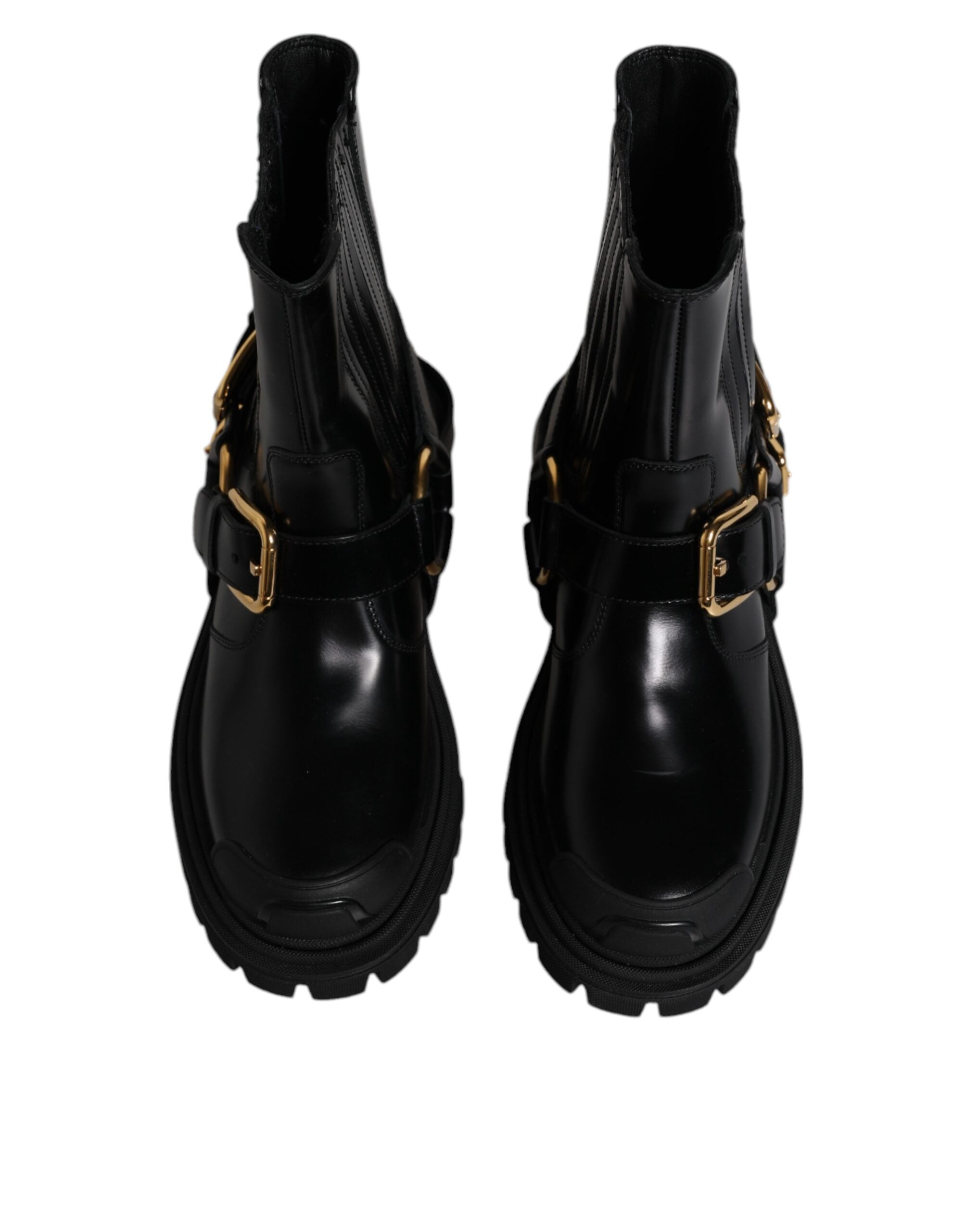 Chaussures de trekking Dolce & Gabbana, bottines noires en cuir avec élastiques pour un style slip-on élégant.
