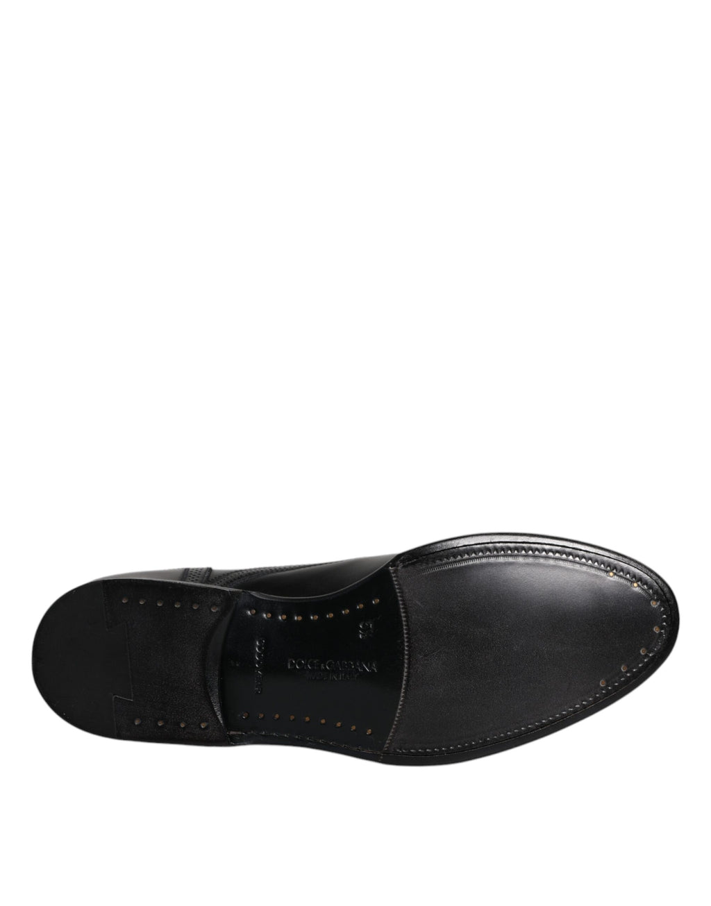 Chaussures derby en cuir noir Dolce & Gabbana, élégantes et formelles avec détails wingtip, chaussures pour homme raffinées.