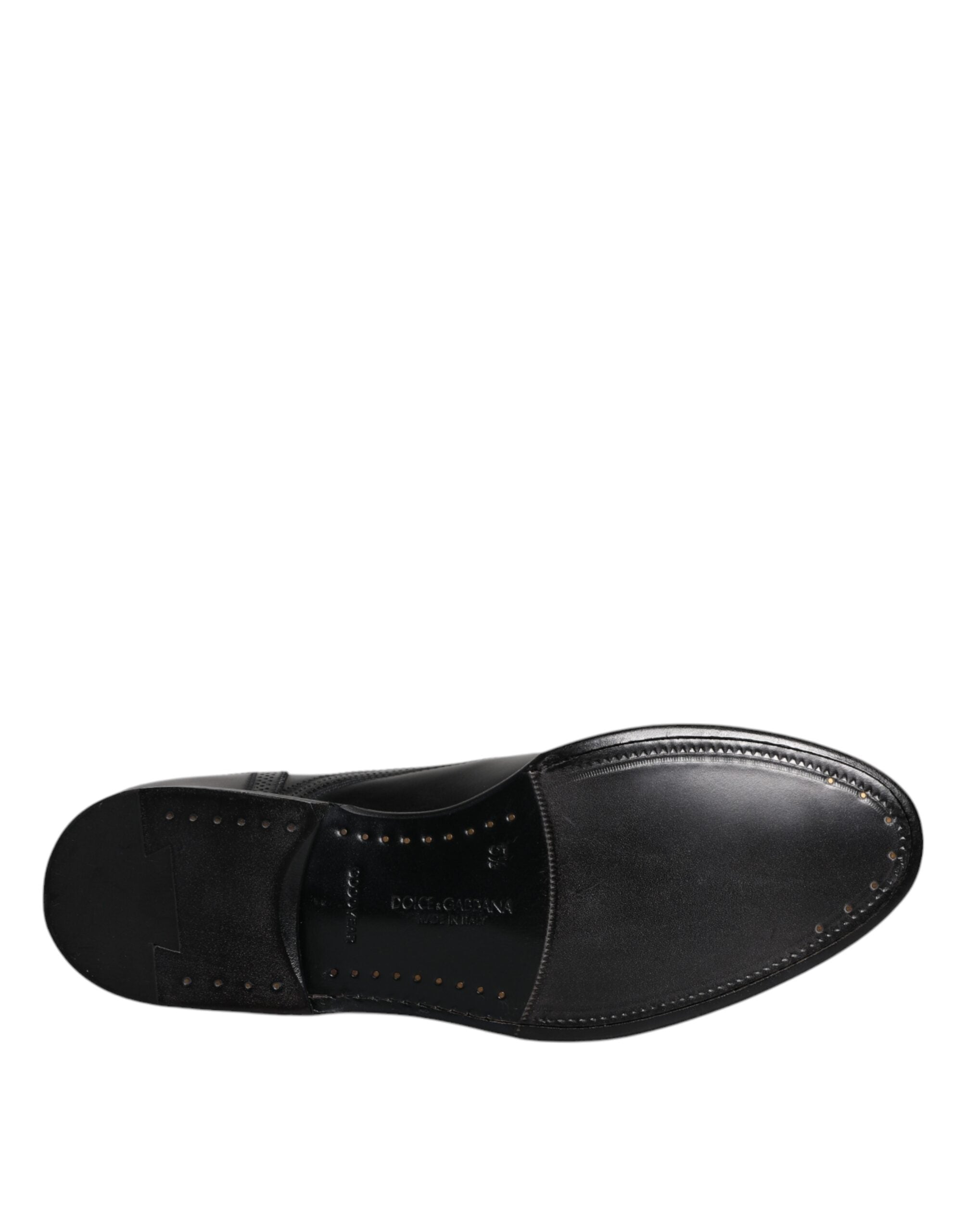 Chaussures derby en cuir noir Dolce & Gabbana, élégantes et formelles avec détails wingtip, chaussures pour homme raffinées.
