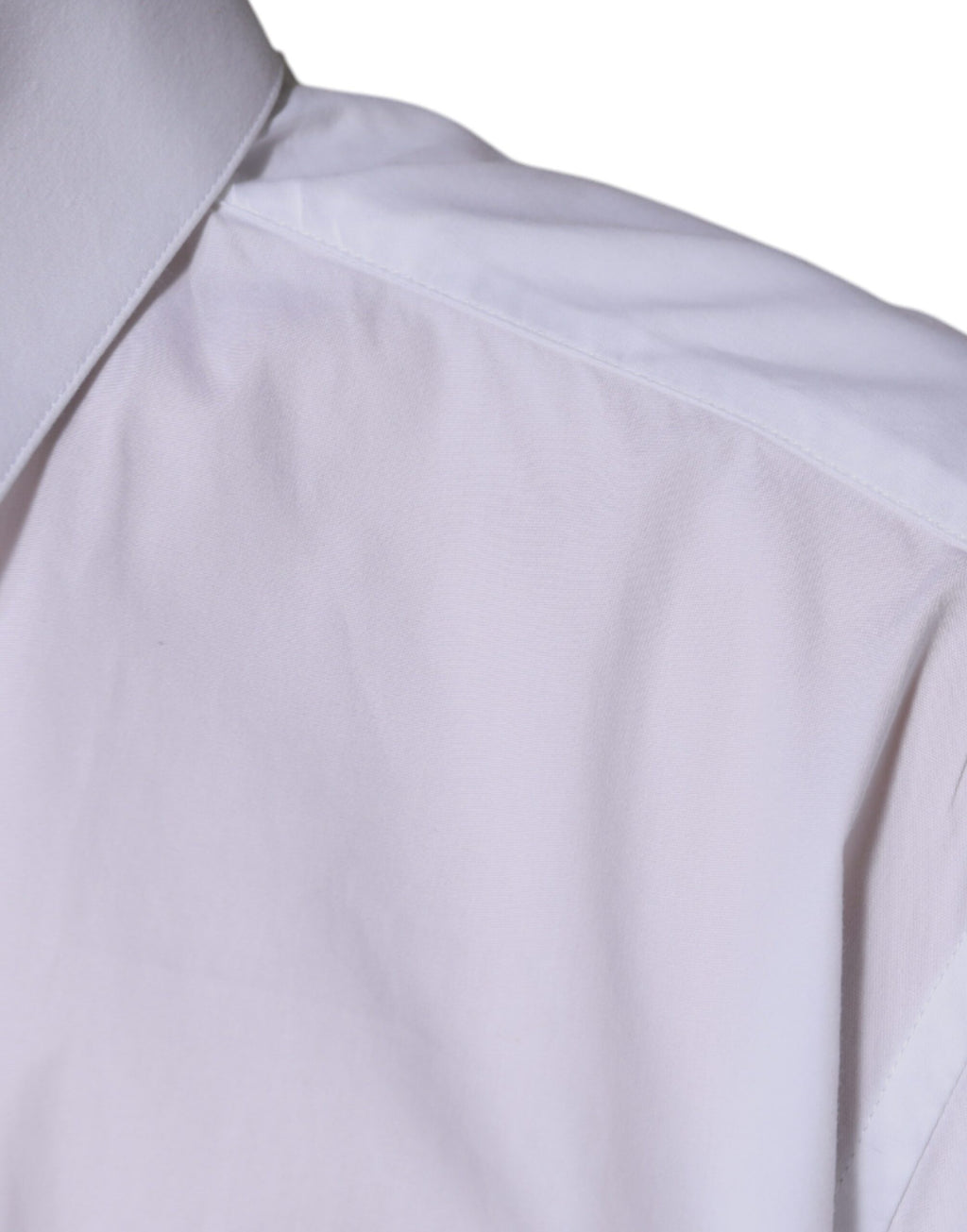 Chemise longue blanche en coton Dolce & Gabbana avec manches longues et détails en or, vue de face.