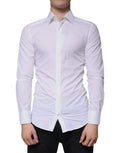 Chemise blanche en coton à manches longues Dolce & Gabbana avec boutons dorés, vue de face sur le mannequin.