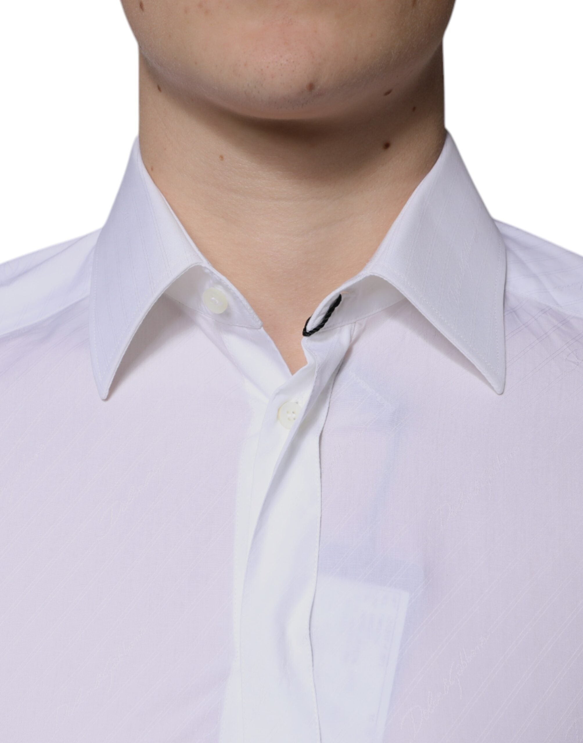 Chemise blanche en coton à manches longues Dolce & Gabbana avec détails dorés, élégante et sophistiquée.