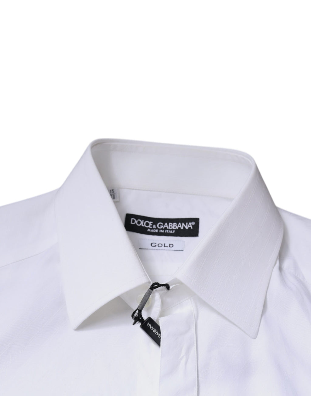Chemise Dolce & Gabbana en coton blanc à manches longues avec détails dorés, élégante et sophistiquée.