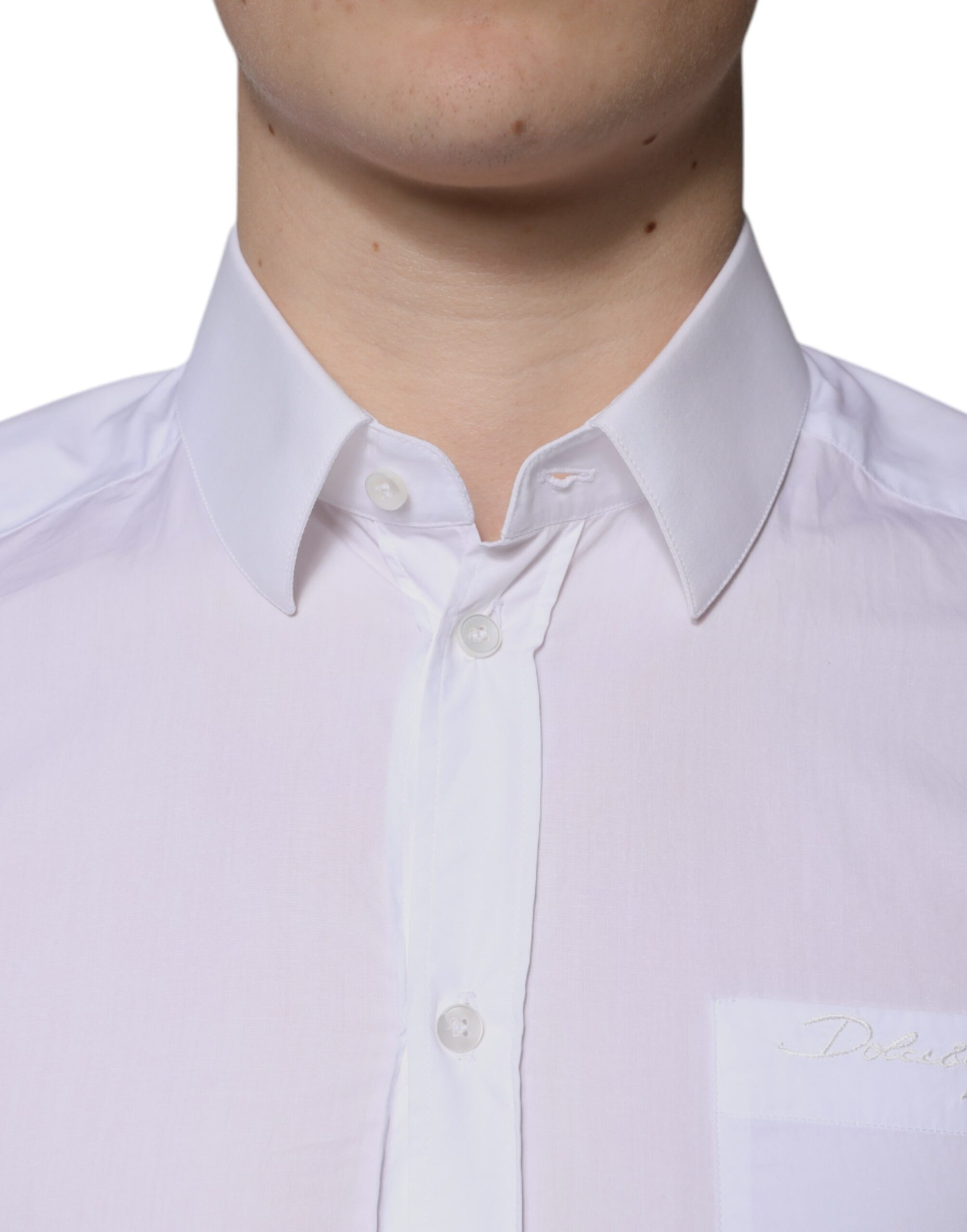 Chemise homme Dolce & Gabbana en coton blanc à manches longues avec détails dorés, élégante et sophistiquée.