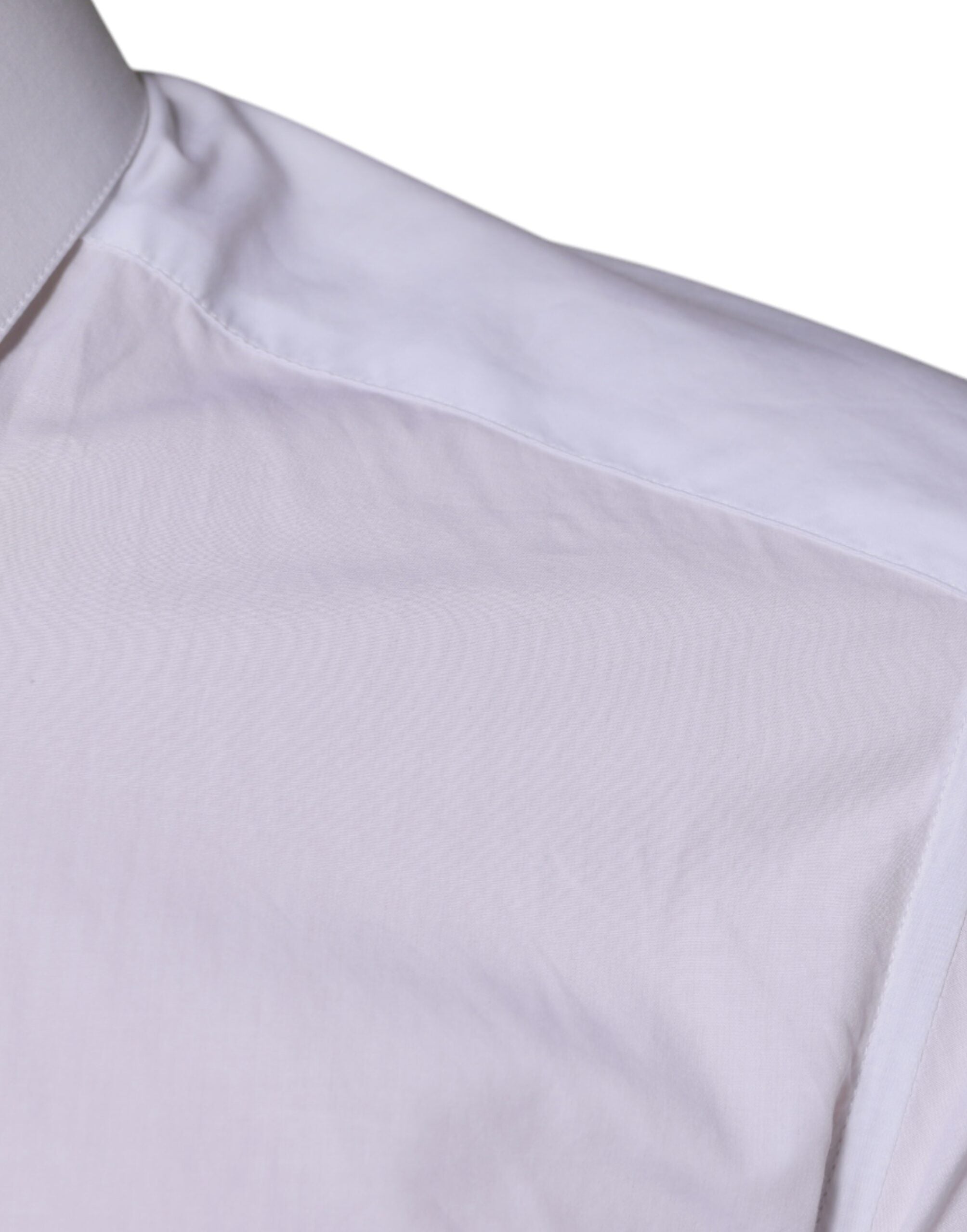 Chemise homme Dolce & Gabbana en coton blanc à manches longues et détails dorés, élégante et sophistiquée.