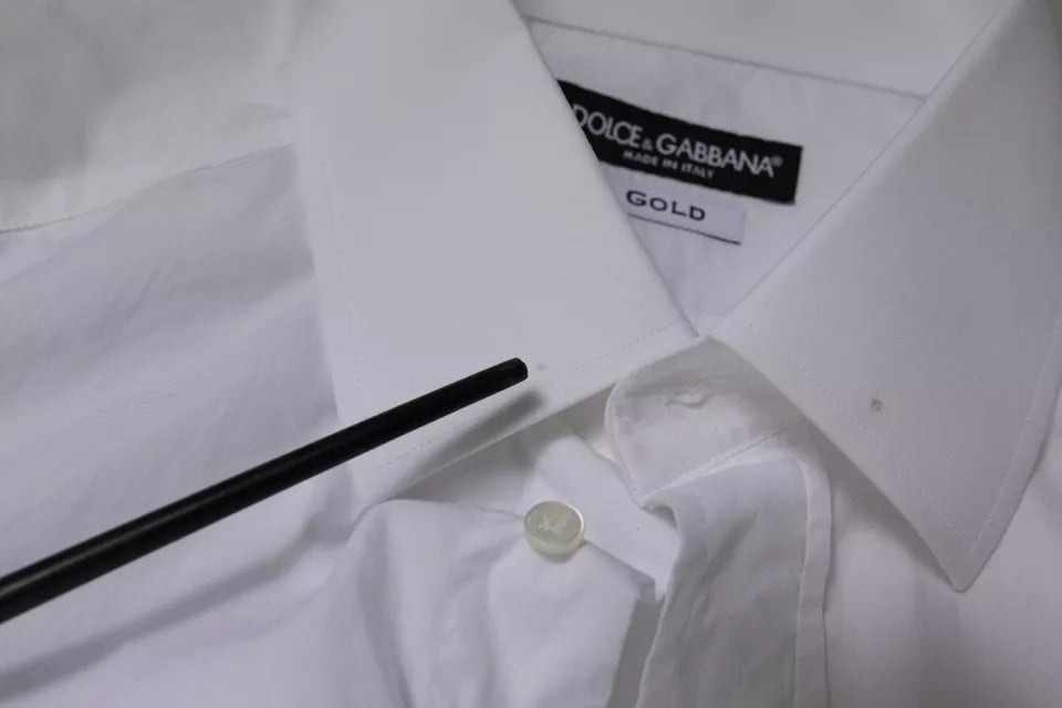 Chemise homme blanche en coton Dolce & Gabbana, coupe slim, avec détails dorés pour une tenue élégante.