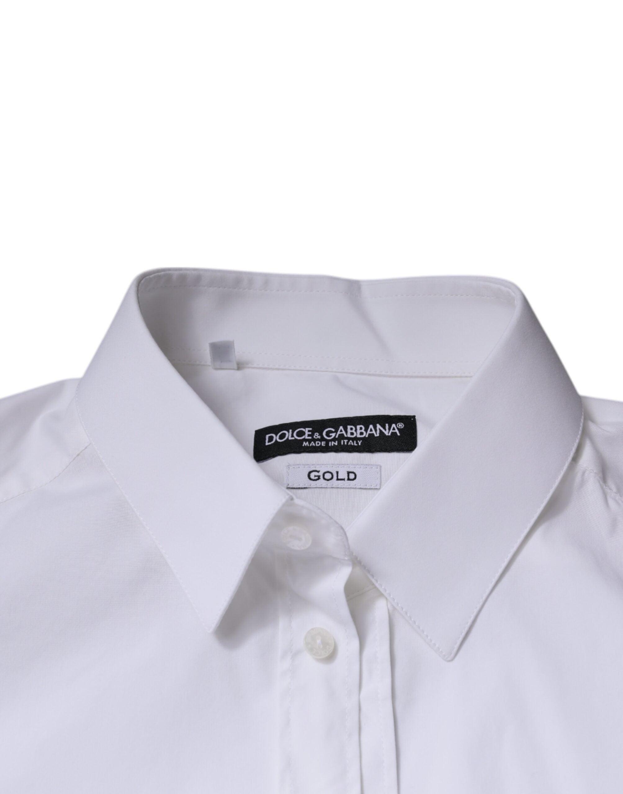 Chemise blanche en coton à manches longues Dolce & Gabbana, élégante et raffinée, avec détails dorés visibles sur la photo.