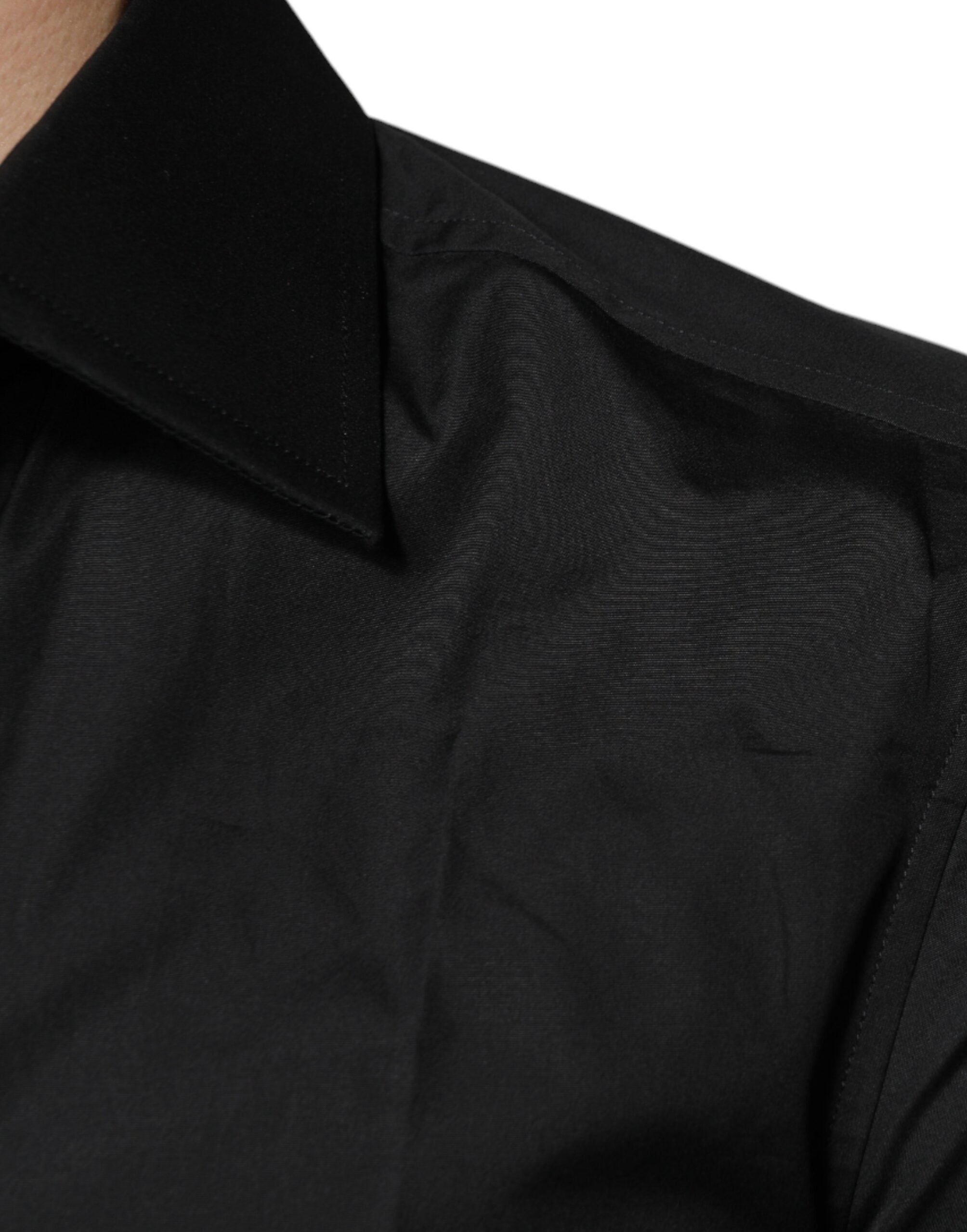 Chemise formelle Dolce & Gabbana en coton noir à manches longues, élégante et classique, vue de face.